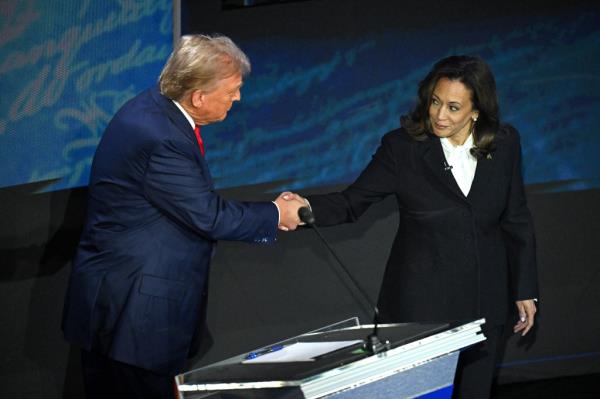 Trump and Harris shaking hands at the beginning of the debate.