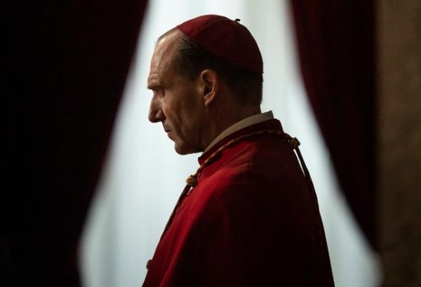 Ralph Fiennes as Cardinal Lawrence contemplates in a scene from Conclave